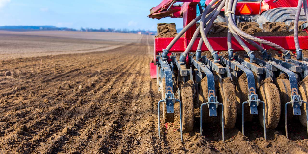 Photo of a tractor plowing a field